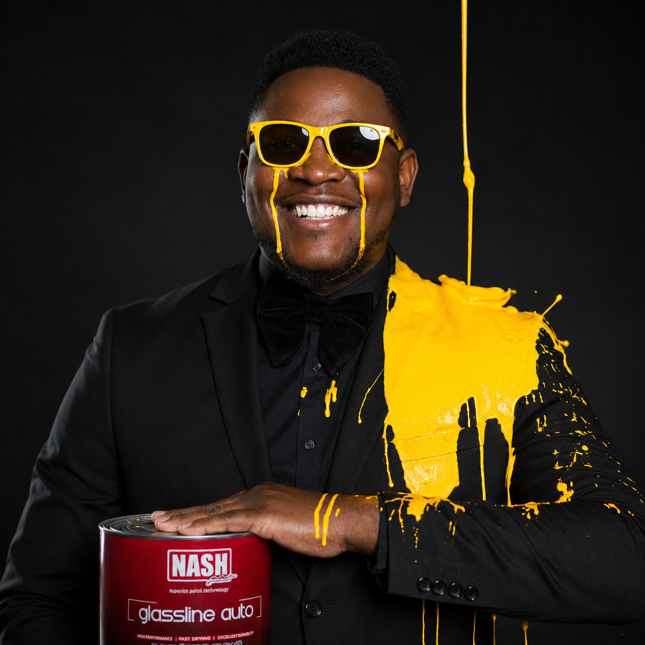 Nash Paints representative with yellow paint and Nash tin